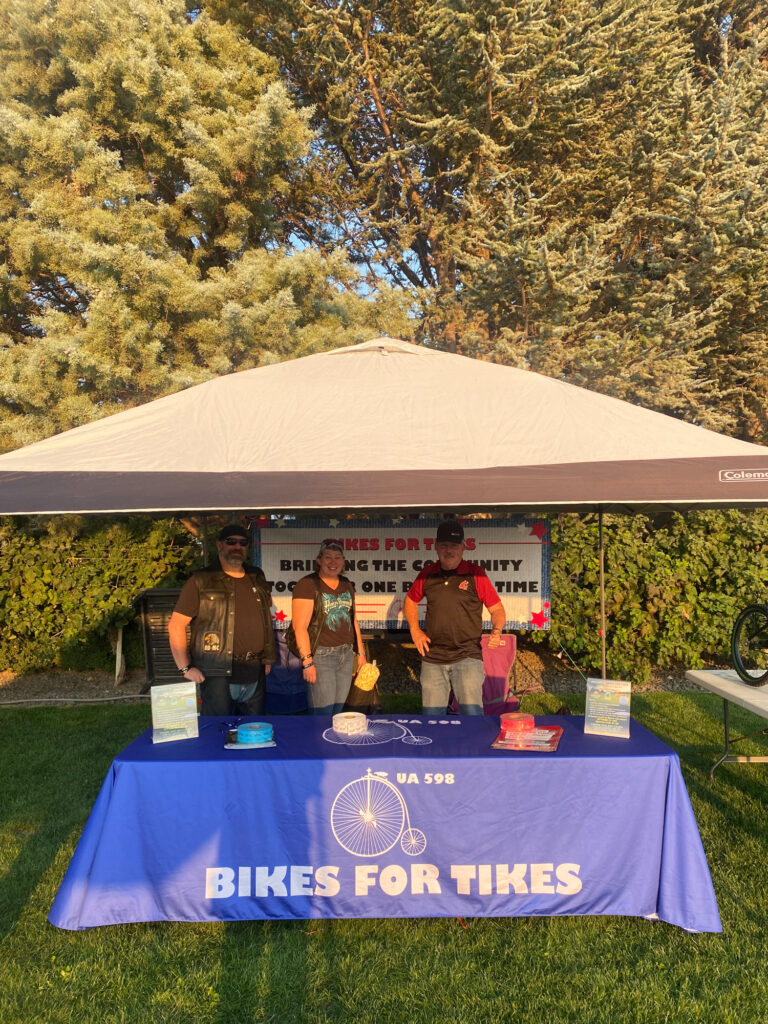 Volunteers at Bikes for Tikes event booth