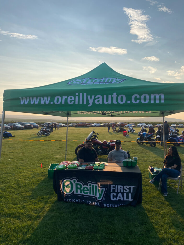O'Reilly Auto Parts tent at outdoor motorcycle event