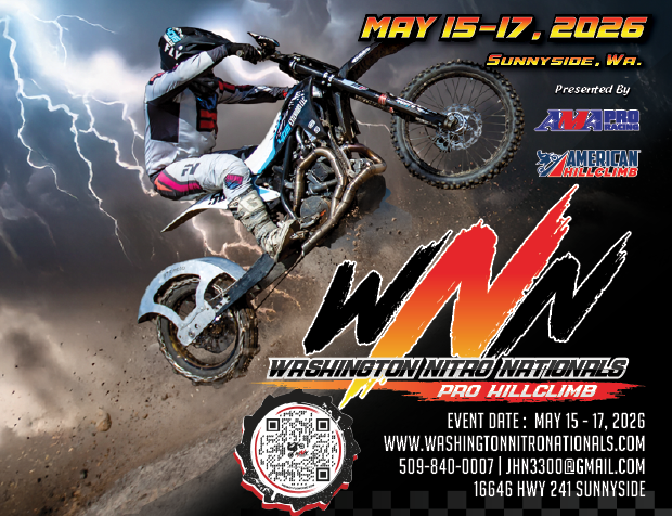Dirt bike rider climbing hill in storm
